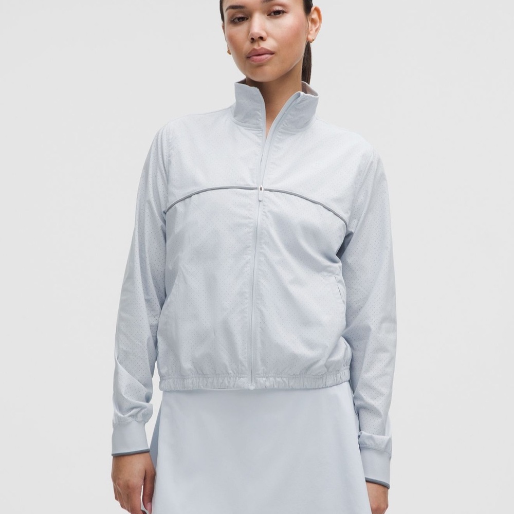Lululemon Court Rival Track Jacket in white with navy piping. Size 8. Never worn